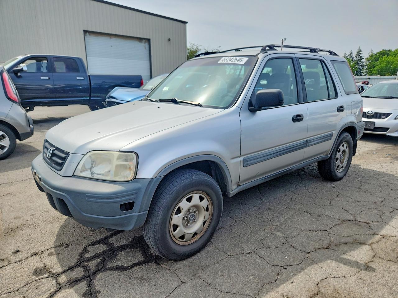 1997 Honda CR-V, VIN JHLRD1847VC016214 — Side