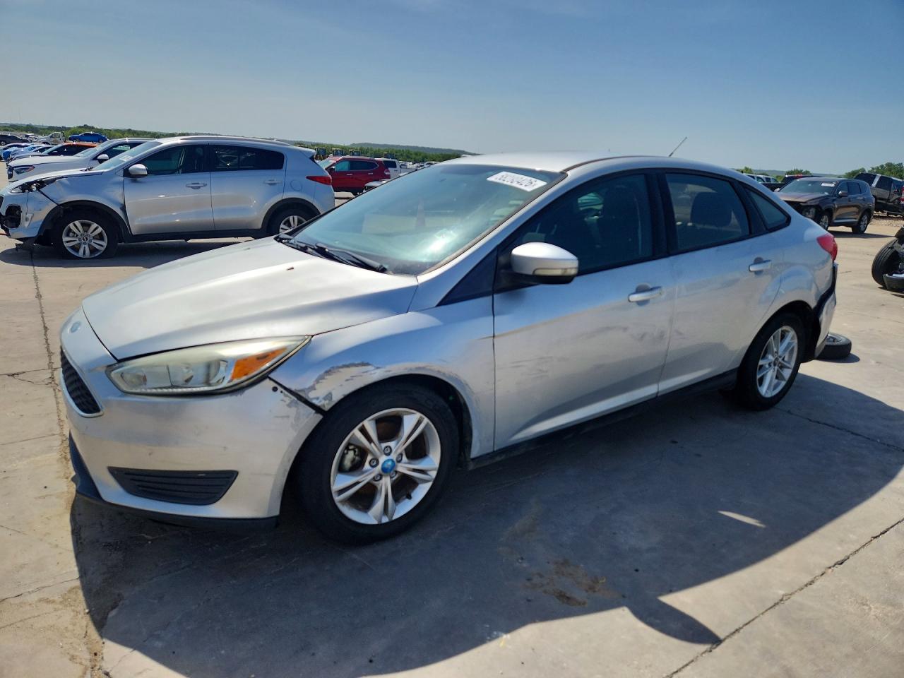 2015 Ford Focus SE, VIN 1FADP3F23FL340649 — Side