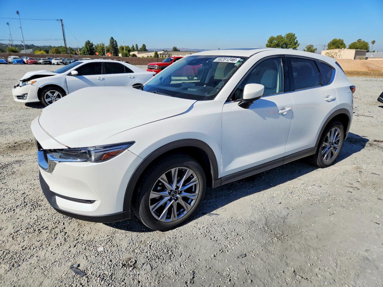 2021 Mazda CX-5 Grand Touring, VIN JM3KFBDM7M0455070 — Front end