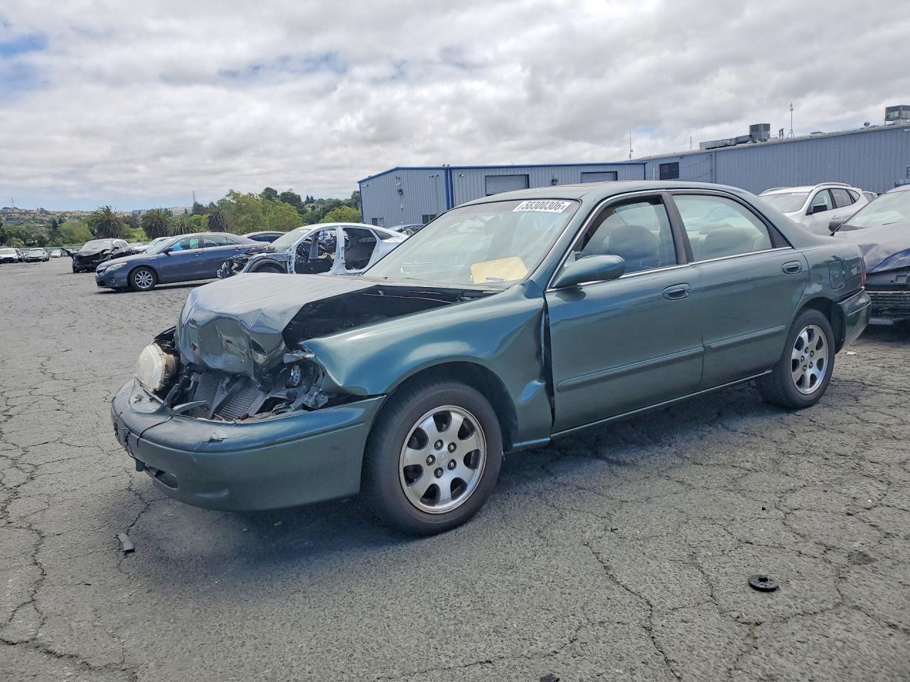 1999 Mazda 626 ES, VIN 1YVGF22C3X5853466 — Front end