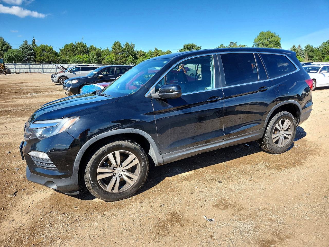 2018 Honda Pilot EX-L, VIN 5FNYF6H59JB027687 — Side