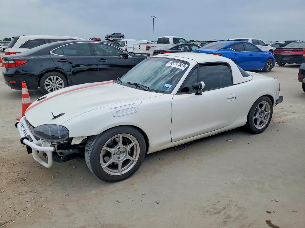 1999 Mazda MX-5 Miata, VIN JM1NB3538X0100989 — Water / flood