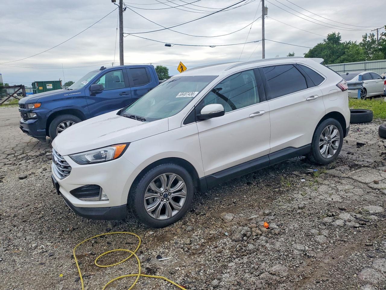 2019 Ford Edge Titanium, VIN 2FMPK3K93KBB52390 — Hail