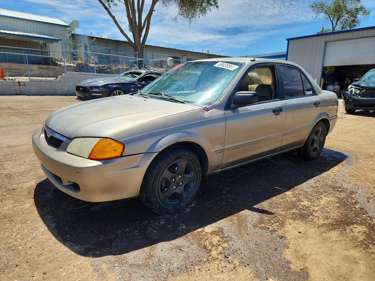 1999 Mazda Protege DX, VIN JM1BJ2220X0179909 — Бок