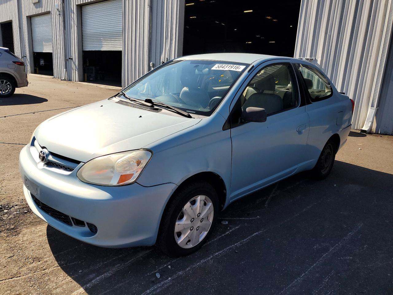 2003 Toyota ECHO, VIN JTDAT123430281393 — Зад