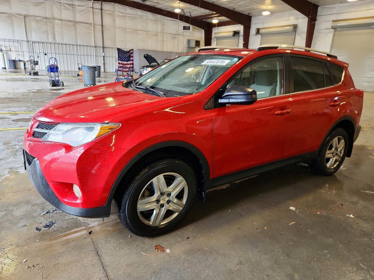 2014 Toyota RAV4 LE, VIN JTMBFREV9EJ012410 — Side