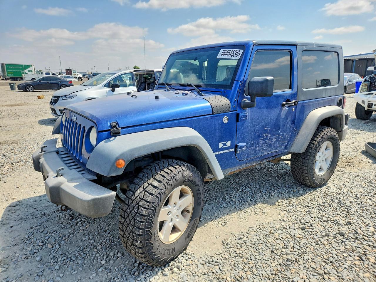 2009 Jeep Wrangler X, VIN 1J4FA24129L712411 — Side