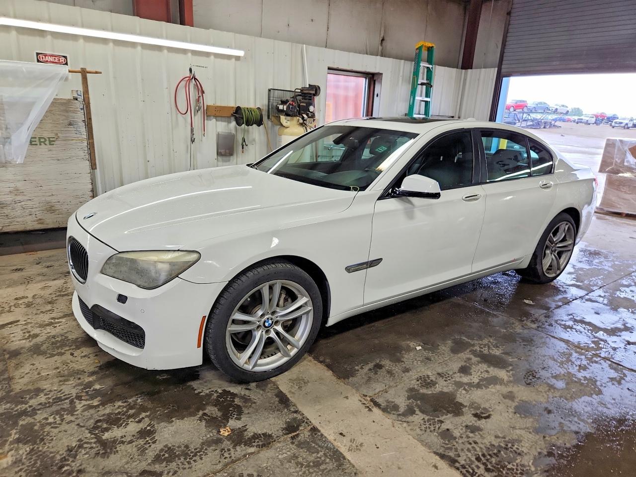 2012 BMW 7 Series 740i, VIN WBAKA4C54CDS99197 — Rear end