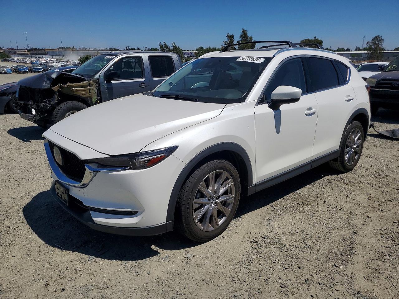 2019 Mazda CX-5 Grand Touring, VIN JM3KFBDM1K1514444 — Front end