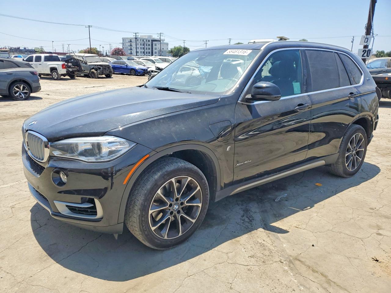 2018 BMW X5 xDrive40e, VIN 5UXKT0C54J0W03024 — Side