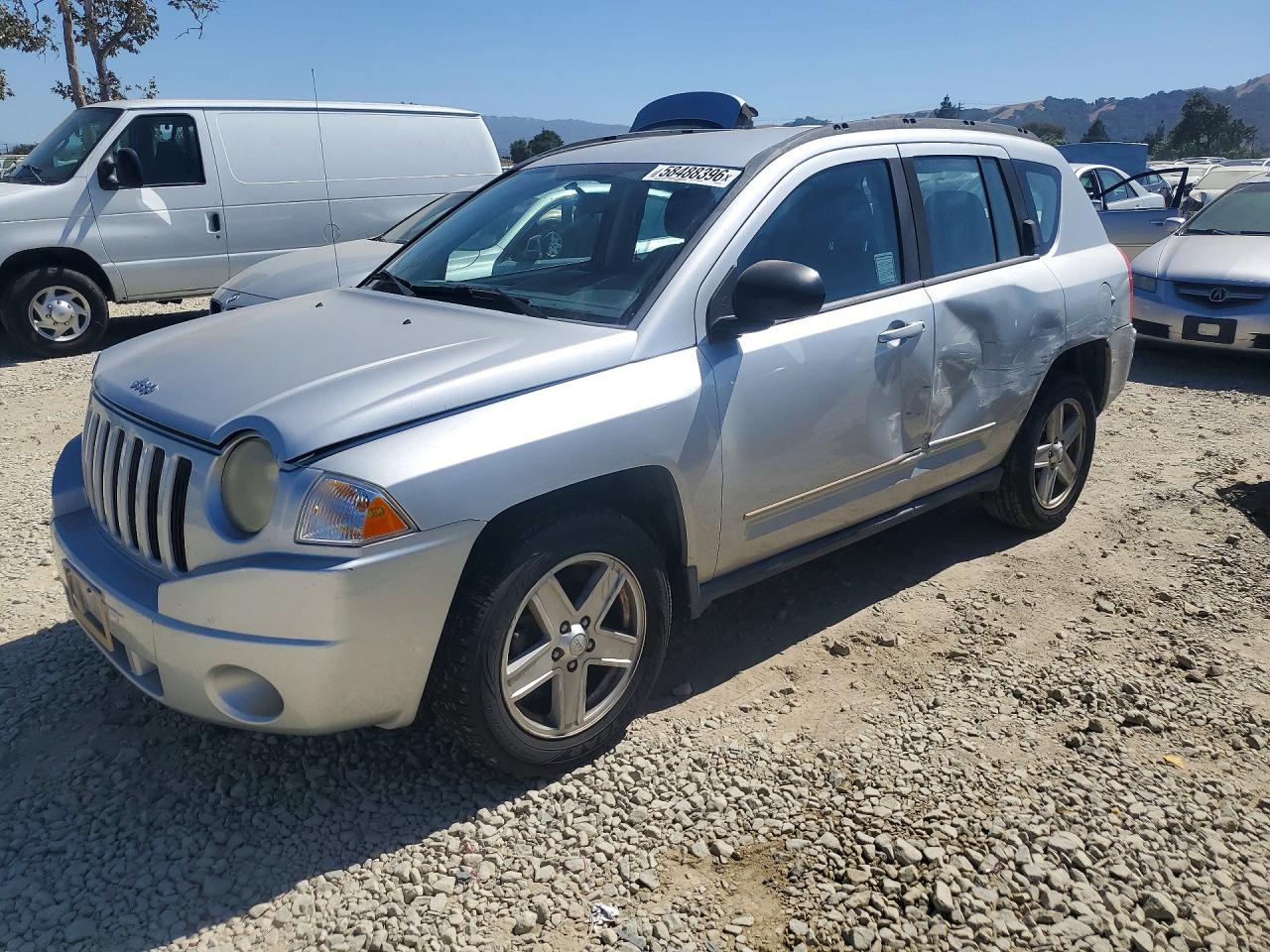 2010 Jeep Compass Sport, VIN 1J4NT4FBXAD558391 — Side