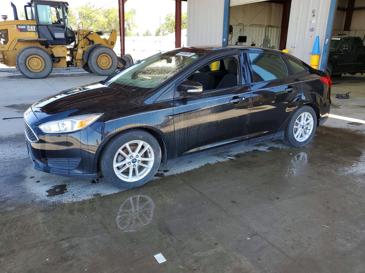 2015 Ford Focus SE, VIN 1FADP3F21FL210594 — Hail