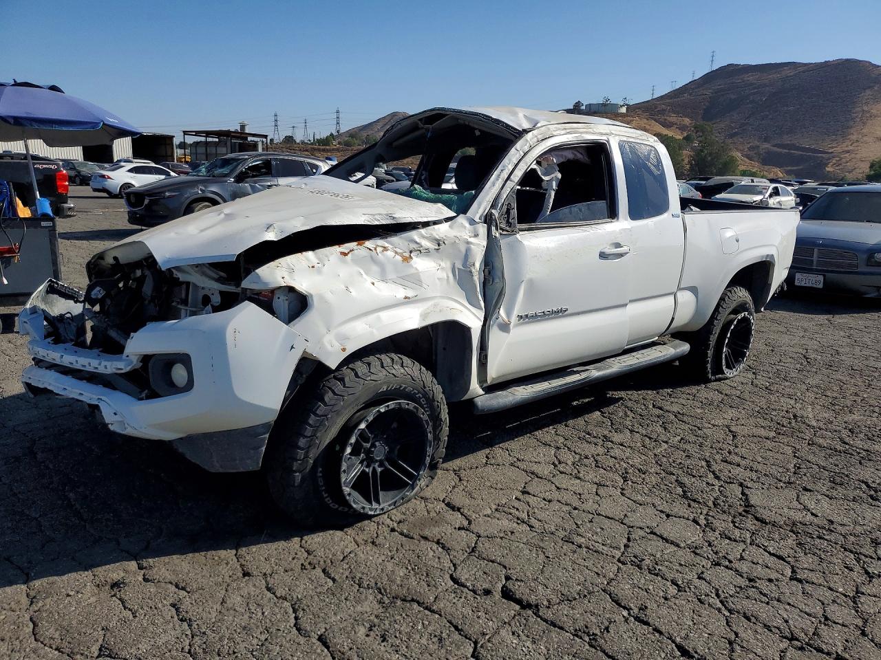 2019 Toyota Tacoma SR5, VIN 5TFRX5GN6KX160864 — Rollover