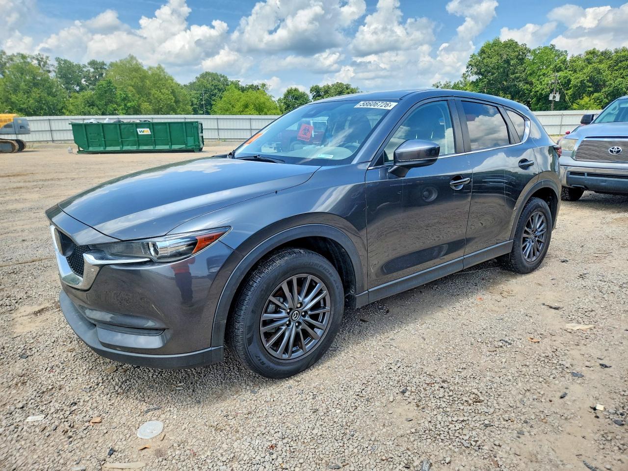 2021 Mazda CX-5 Touring, VIN JM3KFBCMXM0473192 — Water / flood