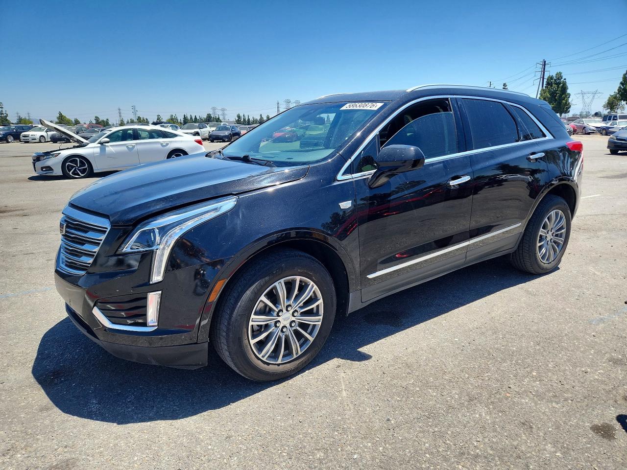 2017 Cadillac XT5 Luxury FWD, VIN 1GYKNBRS0HZ155353 — Мелкие вмятины и царапины