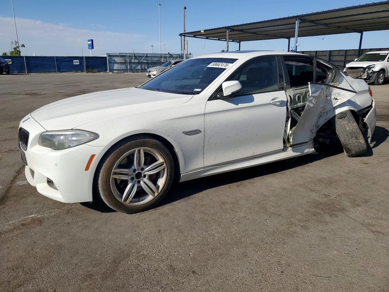 2016 BMW 5 Series 550i, VIN WBAKN9C57GD961698 — Side
