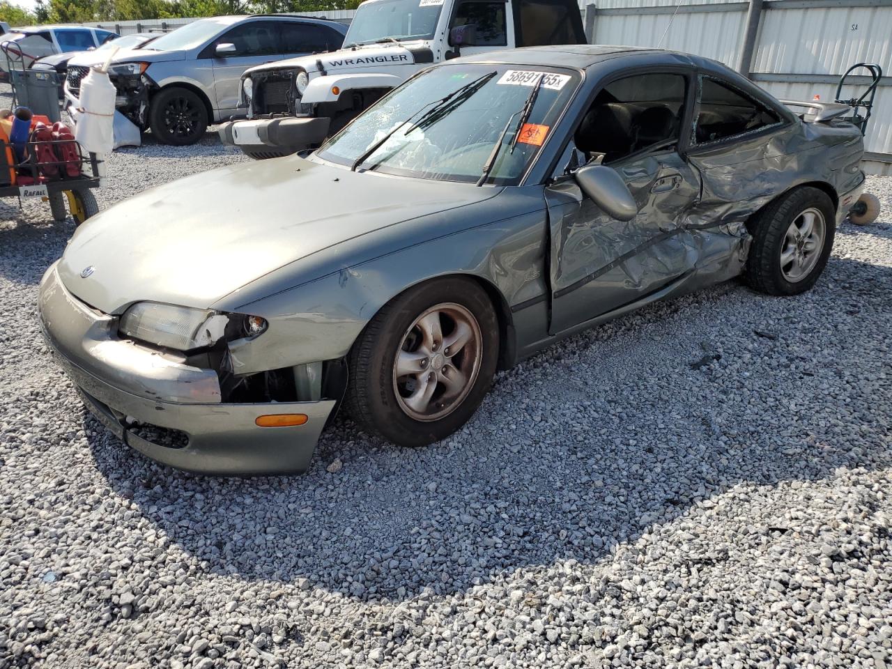 1997 Mazda MX-6, VIN 1YVGE31D4V5613228 — Side