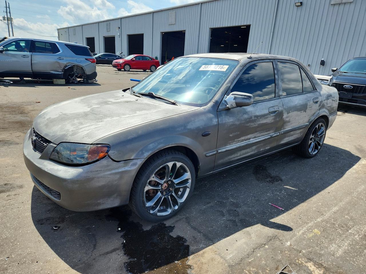 2002 Mazda Protege DX, VIN JM1BJ225X21599996 — Side