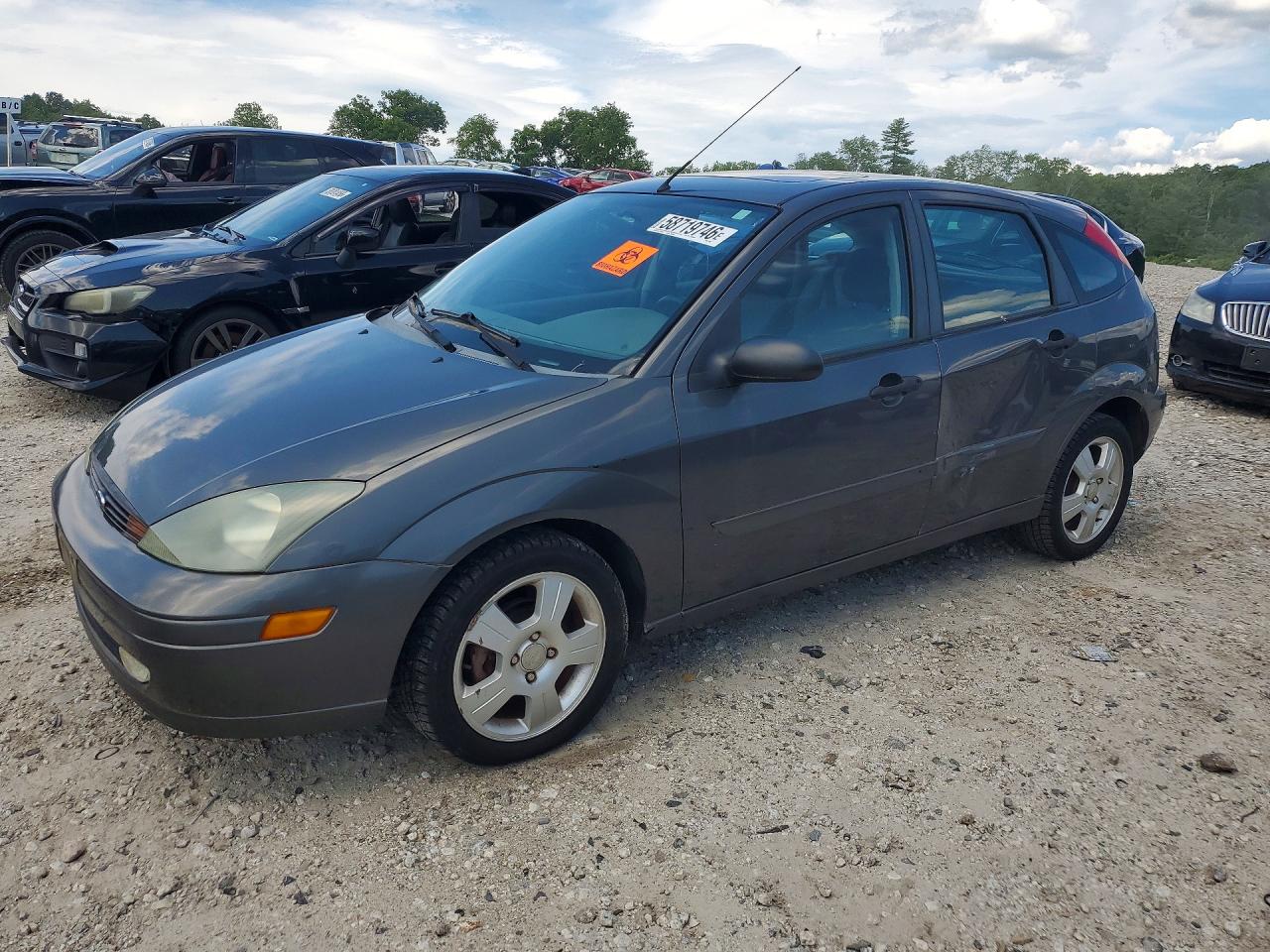 2004 Ford Focus ZX5, VIN 3FAFP37Z84R110902 — Бок