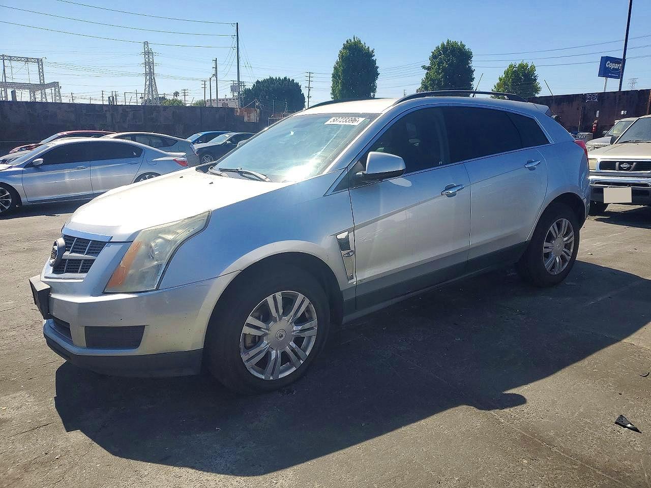2012 Cadillac SRX, VIN 3GYFNGE3XCS645771 — Front end