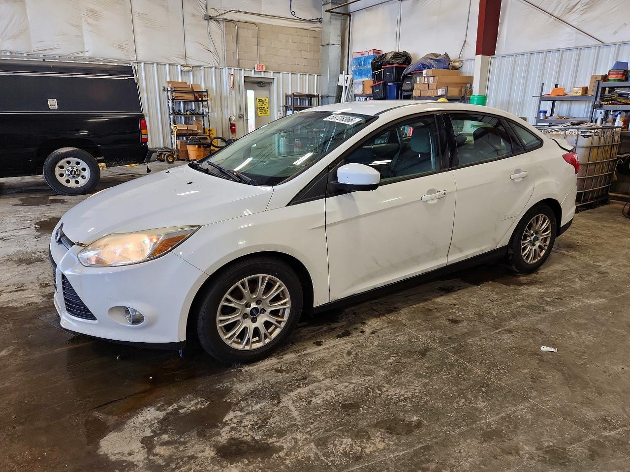 2012 Ford Focus SE, VIN 1FAHP3F21CL179473 — Hail