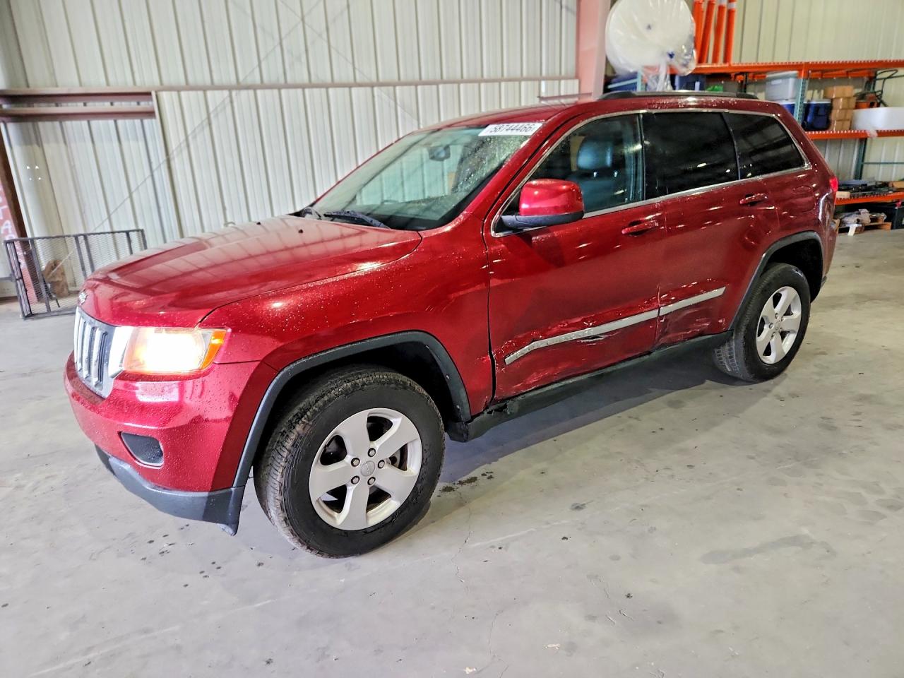 2013 Jeep Grand Cherokee Laredo, VIN 1C4RJEAG1DC571644 — Side
