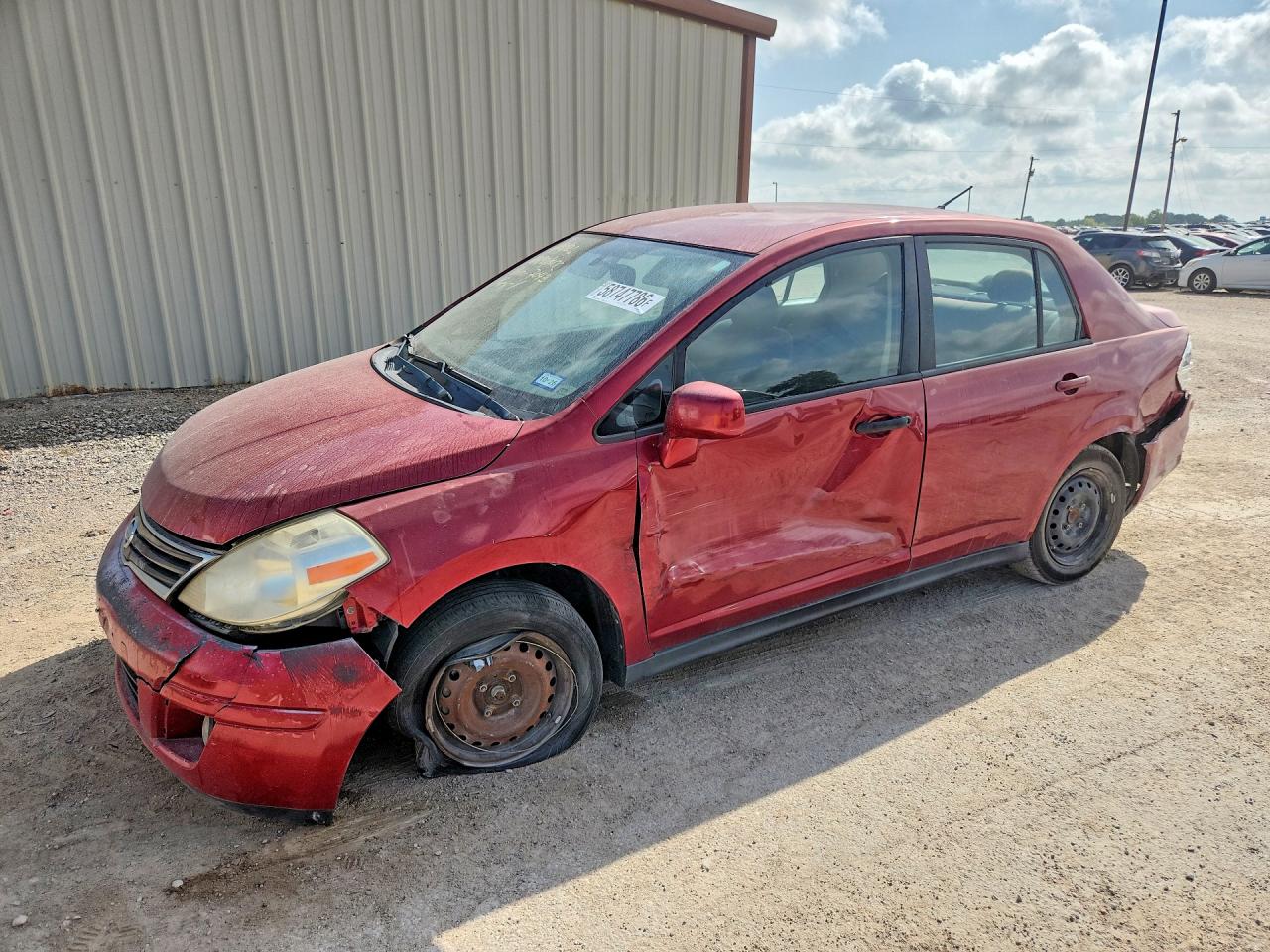 2011 Nissan Versa S, VIN 3N1BC1AP8BL477043 — Side