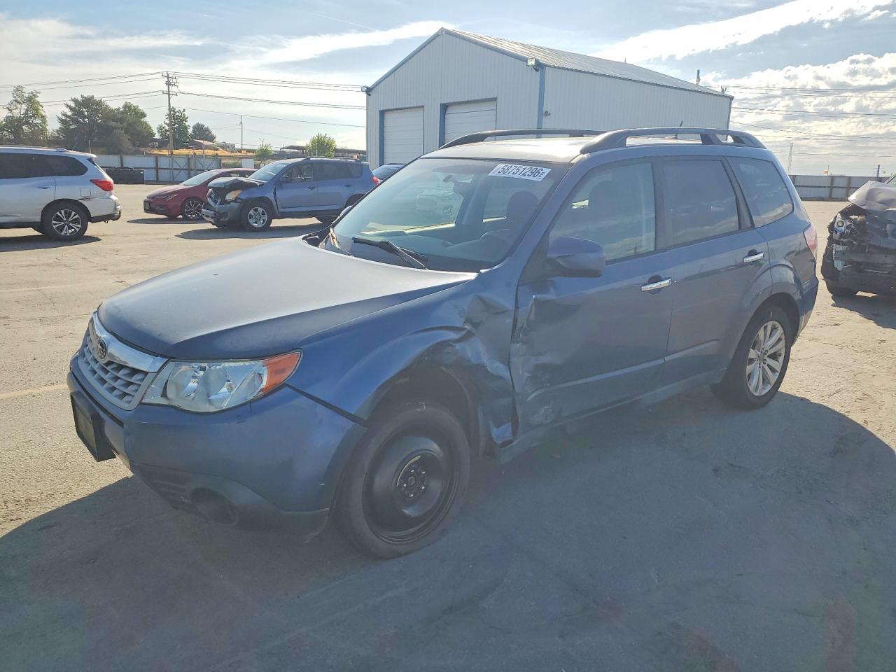 2011 Subaru Forester X Premium, VIN JF2SHADCXBH740575 — Бок