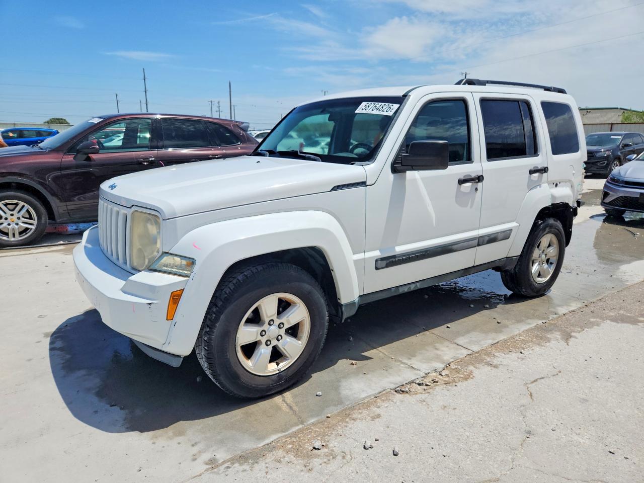 2012 Jeep Liberty Sport, VIN 1C4PJLAK1CW100607 — Зад