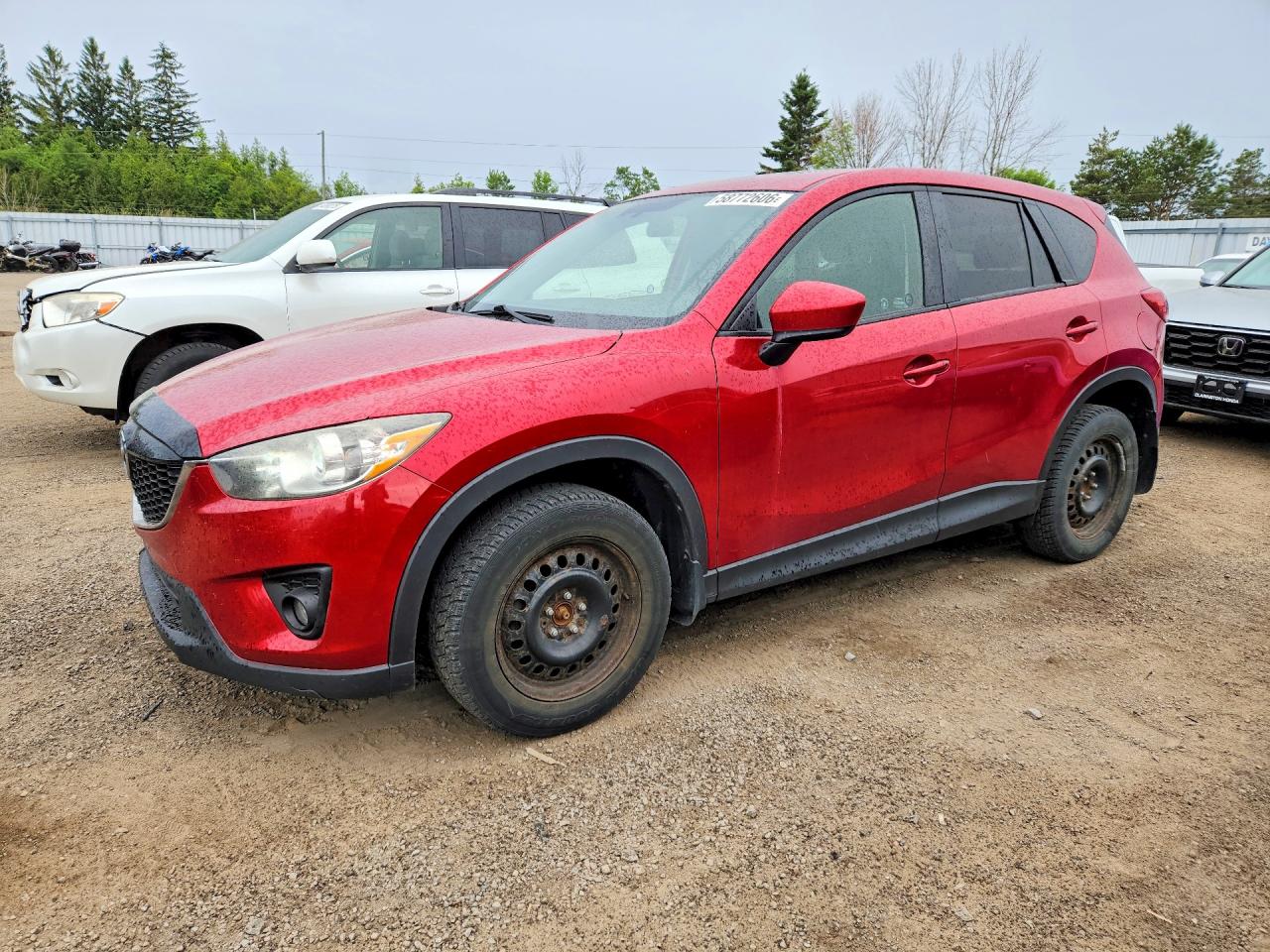 2014 Mazda CX-5 Touring, VIN JM3KE2CY6E0366423 — Side