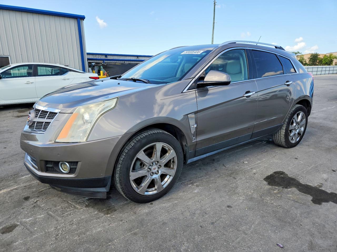 2012 Cadillac SRX Performance Collection, VIN 3GYFNBE34CS548150 — Мелкие вмятины и царапины