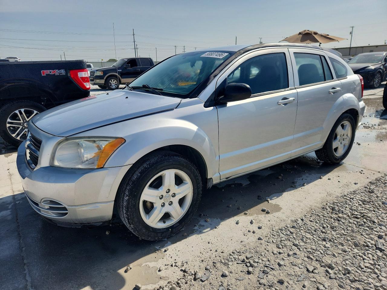 2009 Dodge Caliber SXT, VIN 1B3HB48A39D162486 — Бок