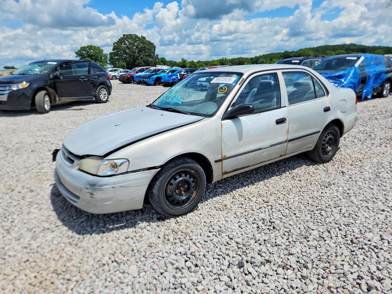 2000 Toyota Corolla CE, VIN 1NXBR12E7YZ394321 — Front end