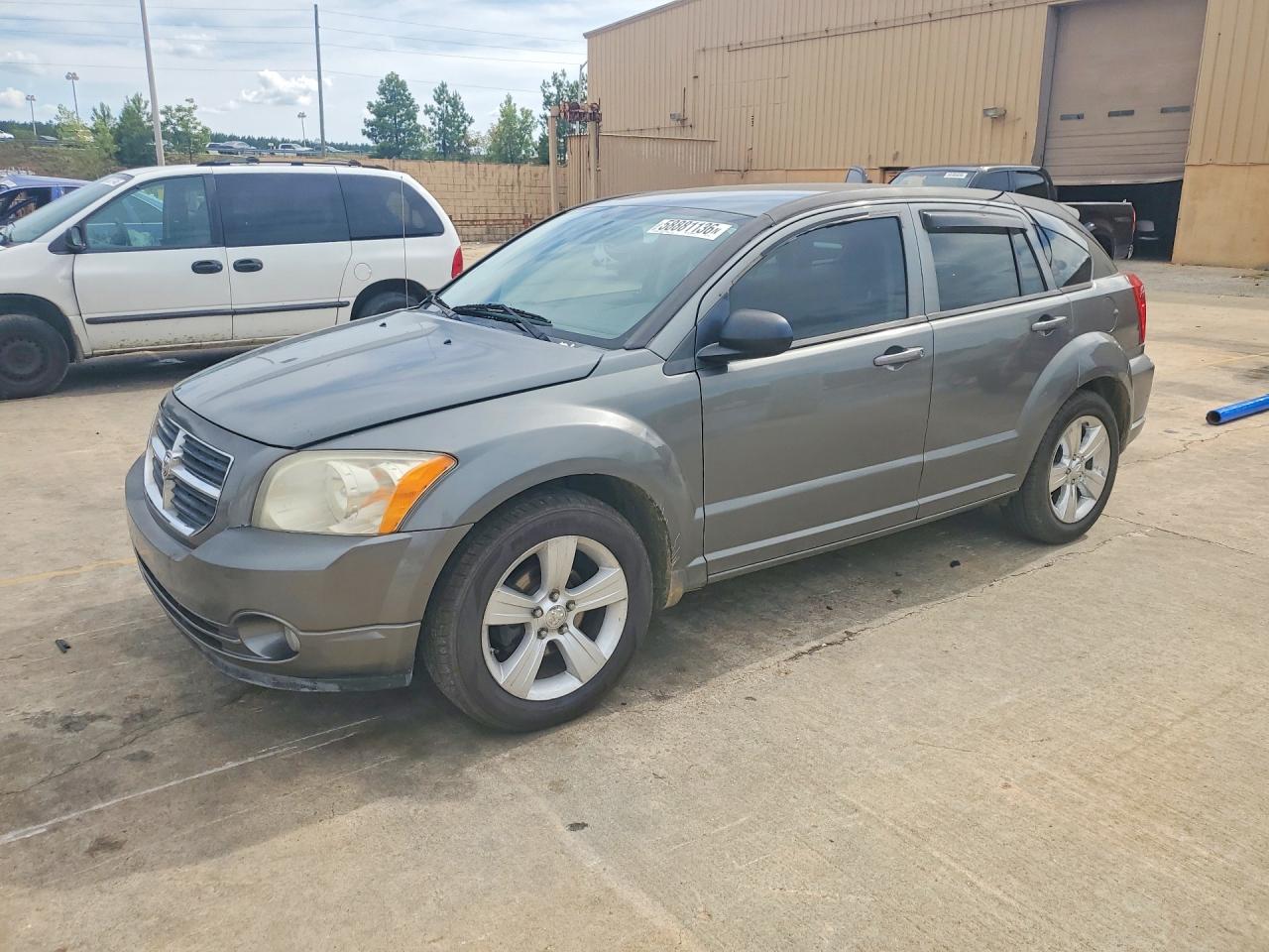 2011 Dodge Caliber Mainstreet, VIN 1B3CB3HA1BD221142 — Side