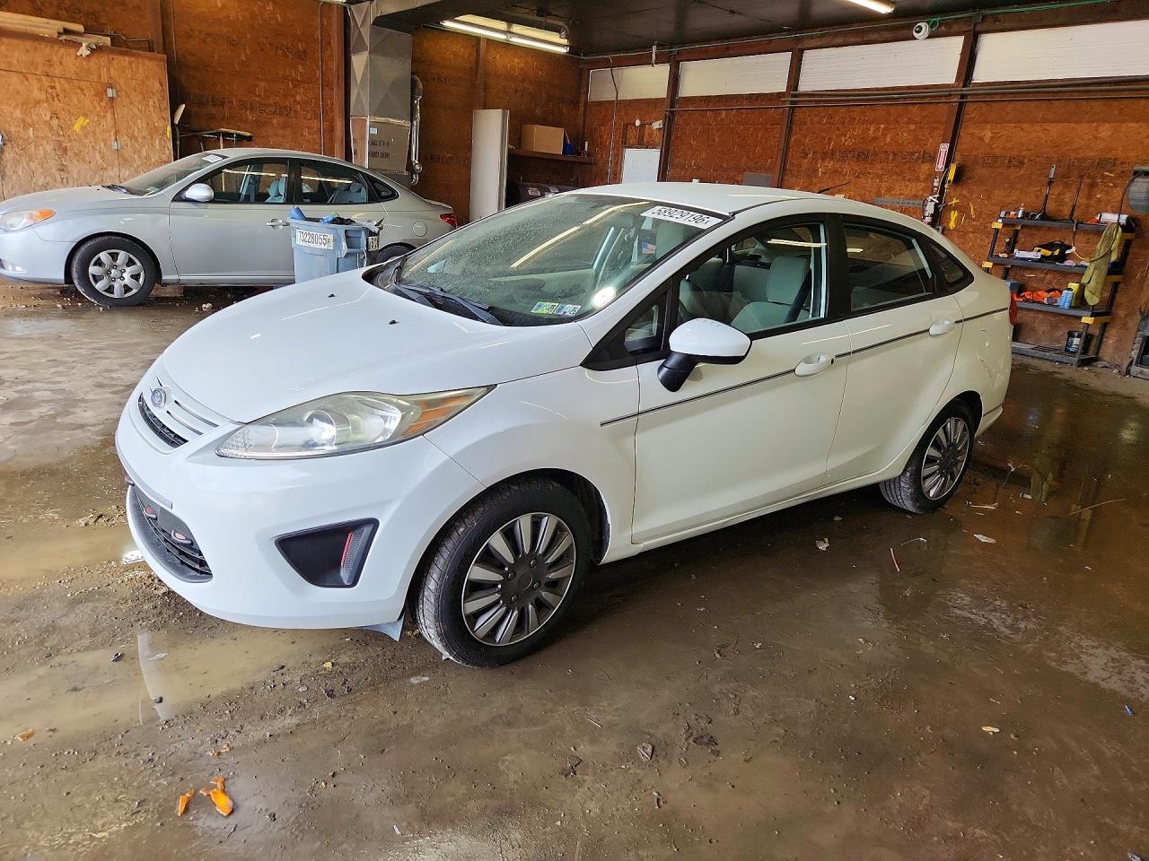 2012 Ford Fiesta S, VIN 3FADP4AJXCM176217 — Side