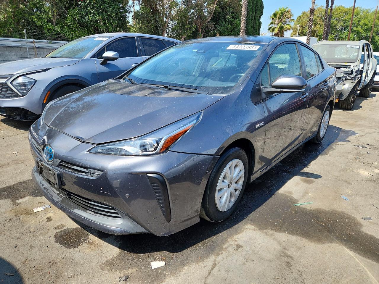 2021 Toyota Prius LE, VIN JTDKAMFUXM3150953 — Зад