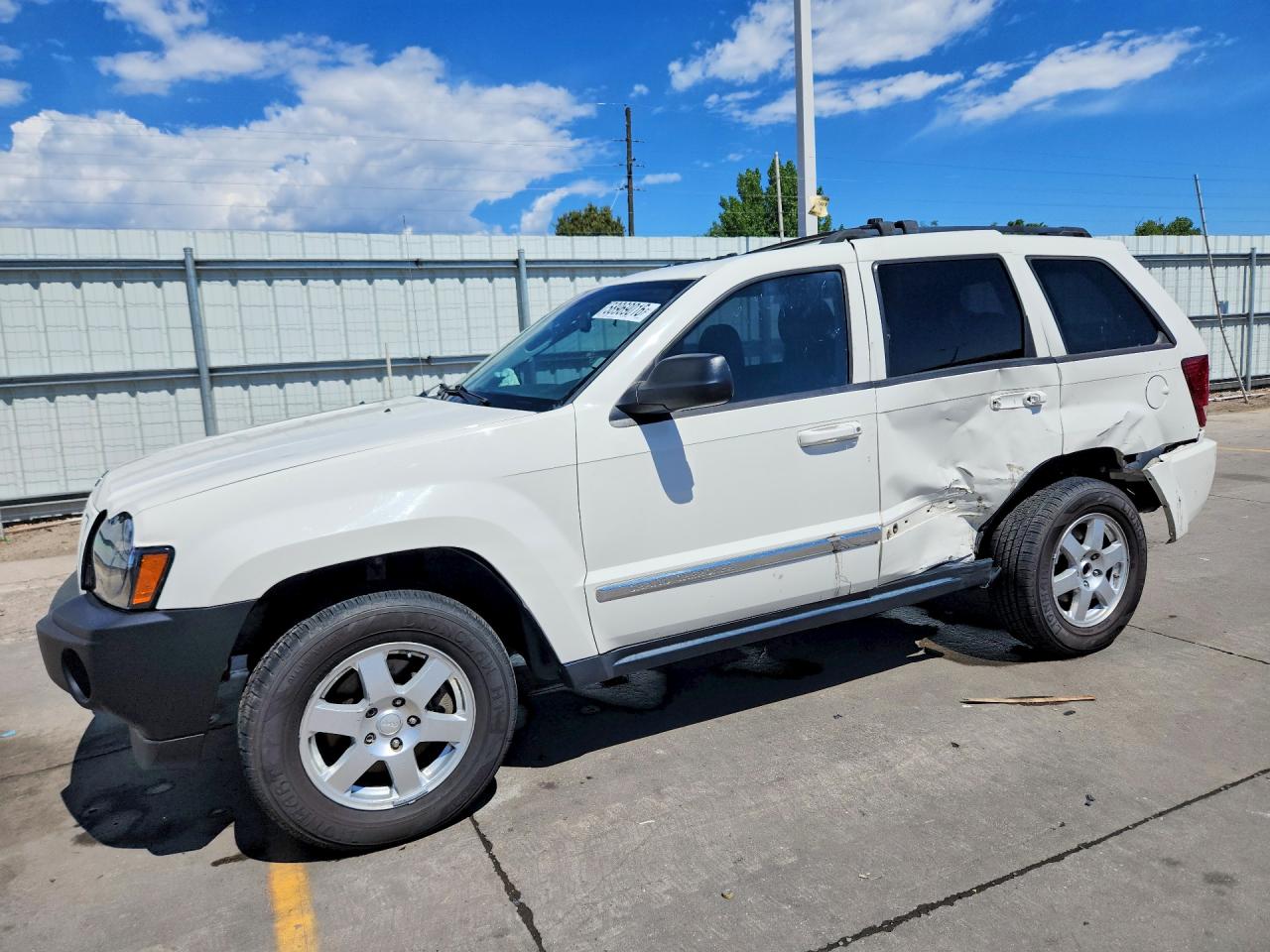 2010 Jeep Grand Cherokee Laredo, VIN 1J4PR4GK5AC127338 — Side