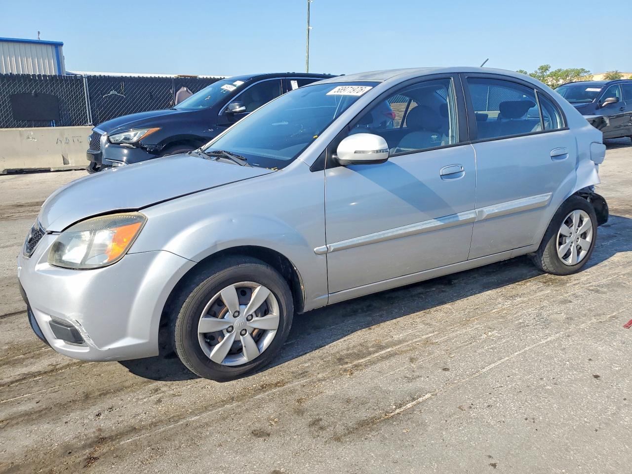 2011 Kia Rio LX, VIN KNADH4A35B6868471 — Зад
