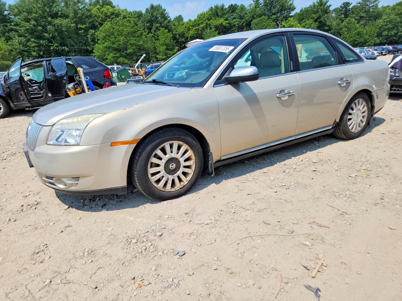 2009 Mercury Sable, VIN 1MEHM40W29G610102 — Side