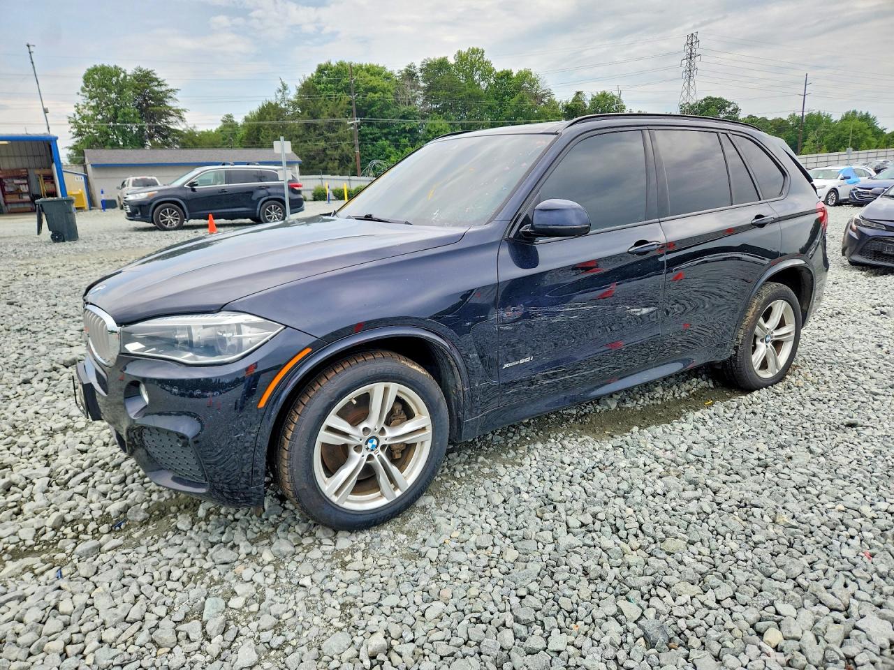 2018 BMW X5 xDrive50i, VIN 5UXKR6C50J0U14582 — Side