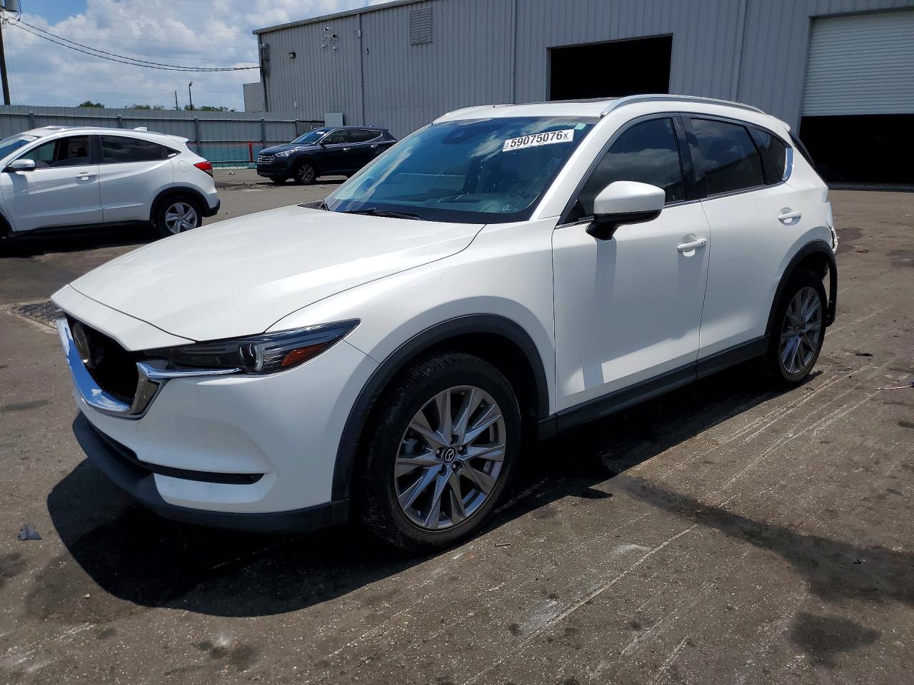 2020 Mazda CX-5 Grand Touring Reserve, VIN JM3KFBAY4L0846926 — Rear end