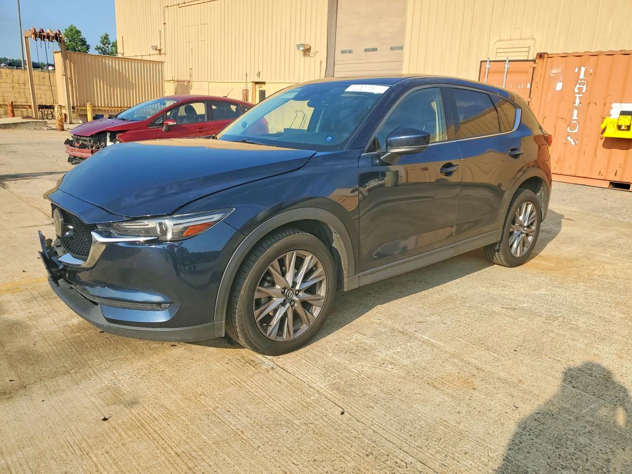 2021 Mazda CX-5 Grand Touring, VIN JM3KFBDM8M0327288 — Front end