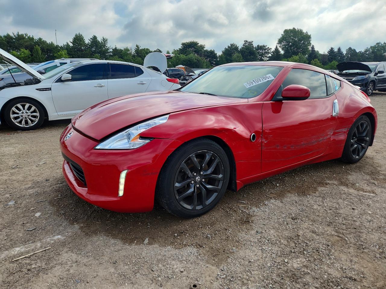 2016 Nissan 370Z Nismo, VIN JN1AZ4EHXGM933815 — Side
