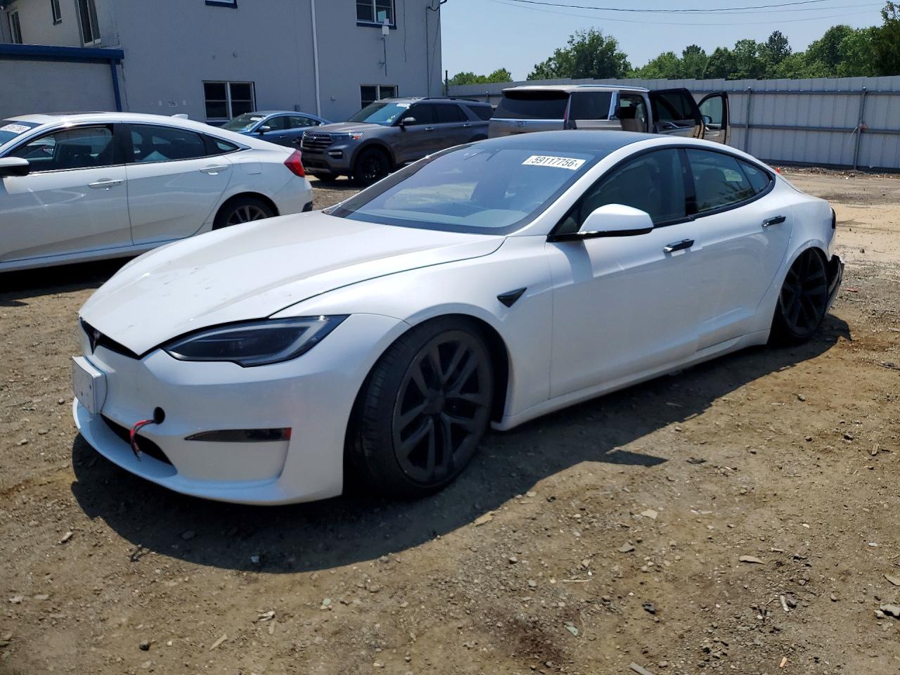 2023 Tesla Model S, VIN 5YJSA1E54PF516115 — Side