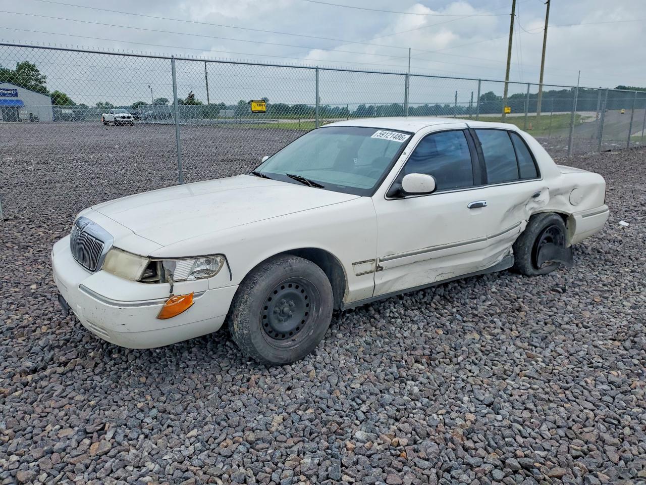 1999 Mercury Grand Marquis GS, VIN 2MEFM74W4XX735306 — Side