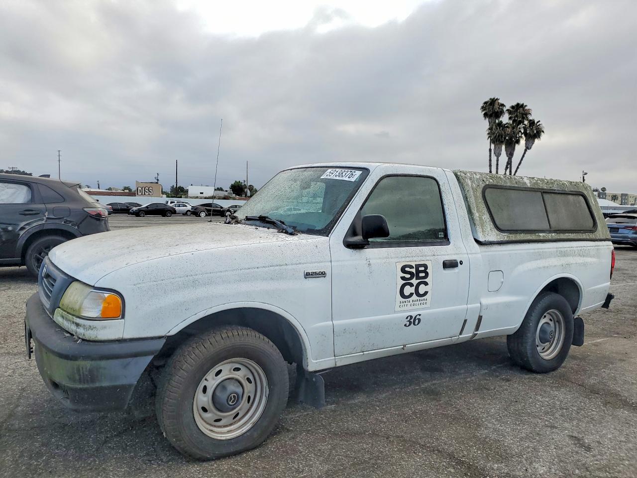 2000 Mazda B-Series SX, VIN 4F4YR12C4YTM14244 — Minor dents and scratches