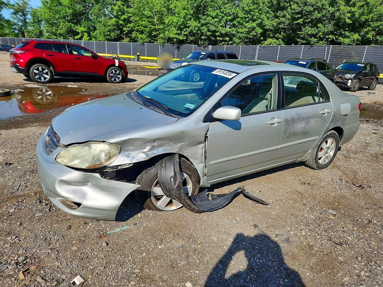 2003 Toyota Corolla CE, VIN 1NXBR32E43Z020513 — Side
