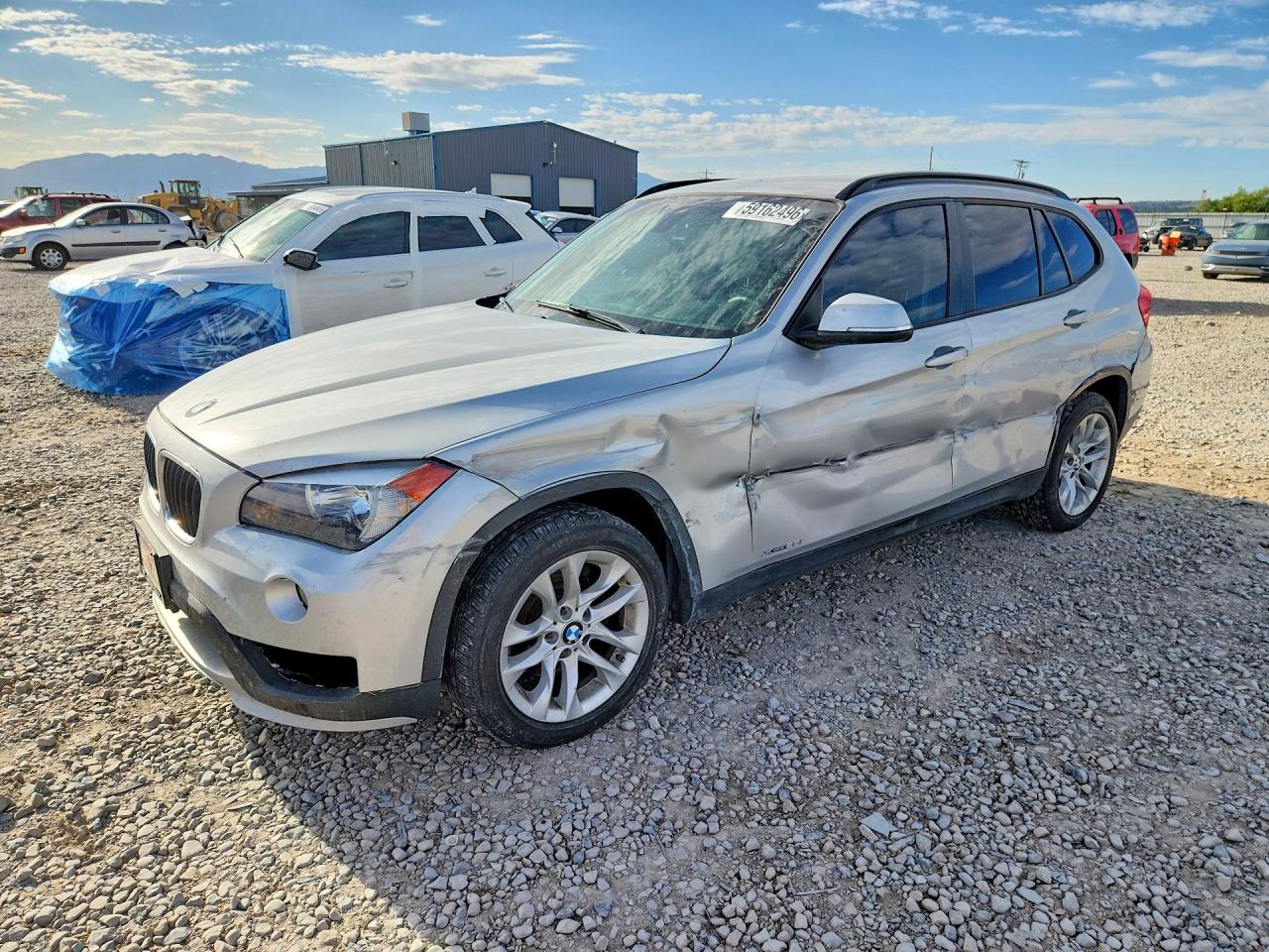 2015 BMW X1 xDrive28i, VIN WBAVL1C56FVY39878 — Side