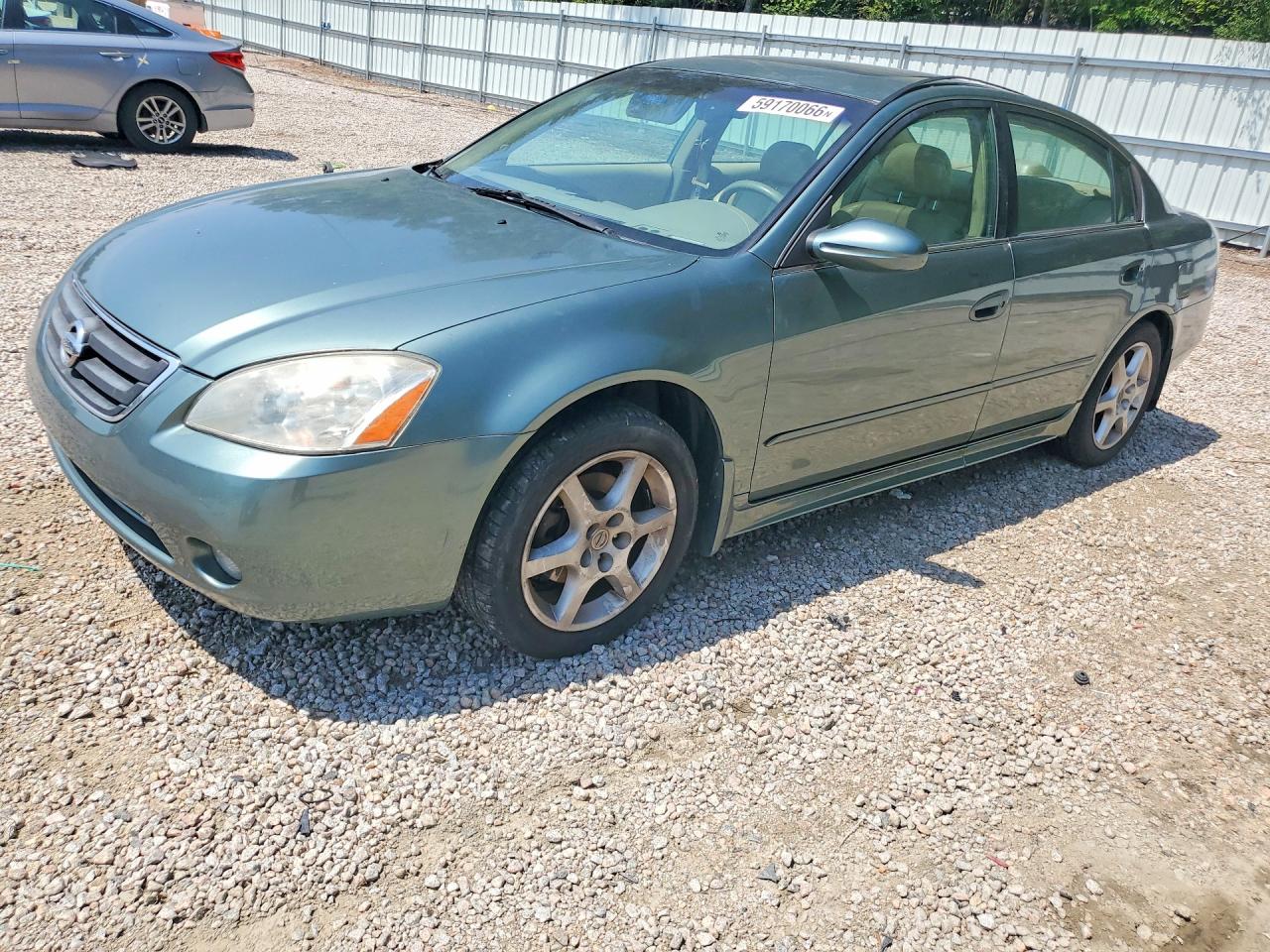 2003 Nissan Altima SE, VIN 1N4BL11E03C331119 — Minor dents and scratches