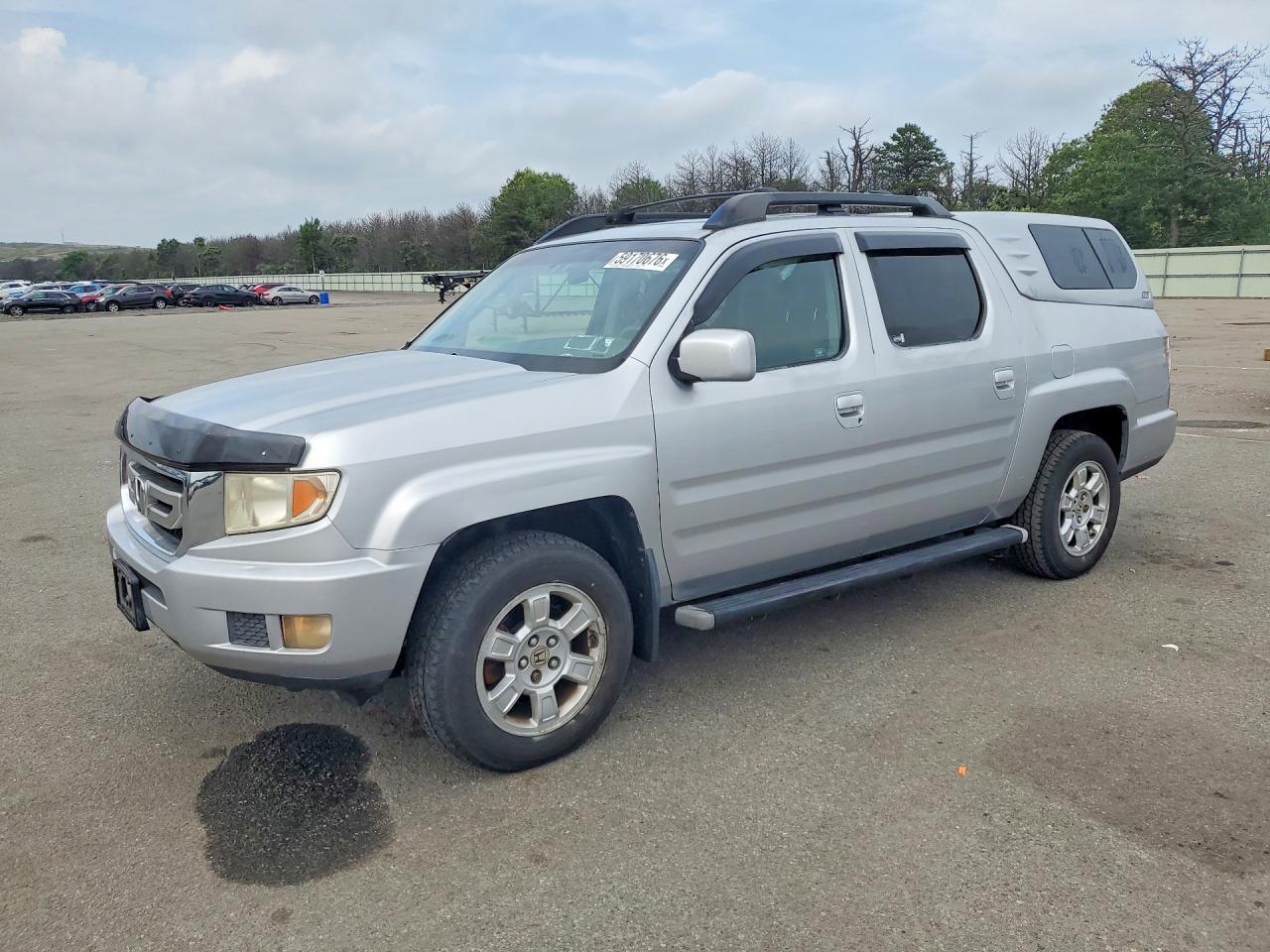 2010 Honda Ridgeline RTS, VIN 5FPYK1F49AB001588 — Undercarriage